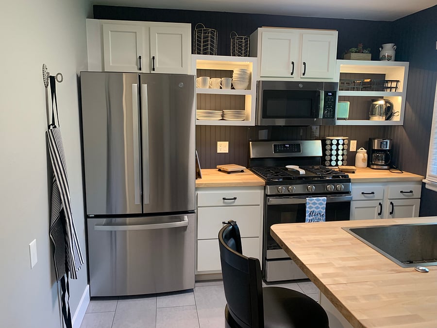 Newly remodeled kitchen includes stainless appliances, and open shelving so you can easily find what you need.