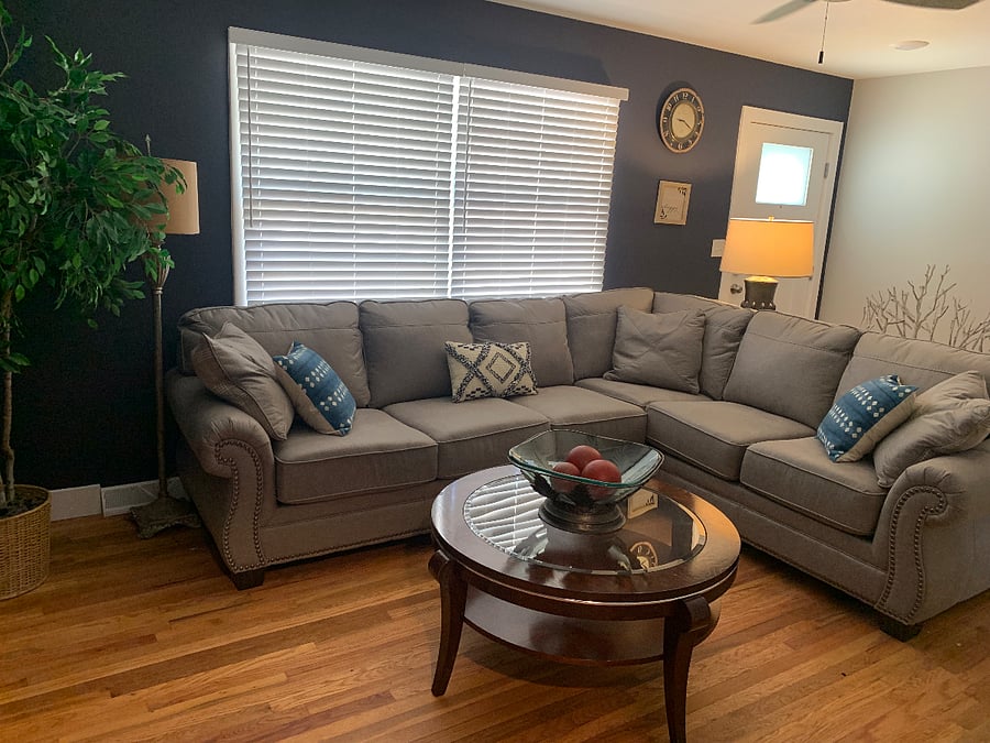 Cozy and inviting sectional as you enter the front door.