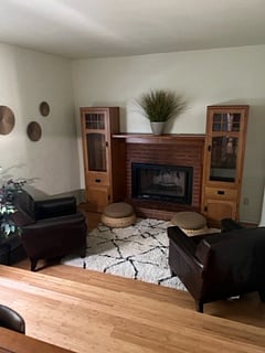 reading area with comfy chairs and fireplace1/2