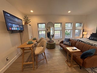From this angle, you see just how inviting the space truly is perfectly set for a quiet meal, a cozy work session, or a movie night in. Simple, stylish, and ready for whatever your day holds.