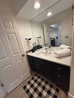 This bathroom feels like a little retreat with its clean lines, lighting, and plenty of cabinet space. The oversized mirror, fresh towels, and cozy details make it easy to relax and reset from the mountain.