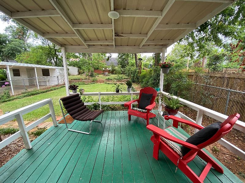 Covered back porch with Adirondack chairs