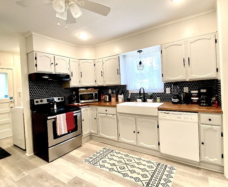 Updated kitchen, fully equipped with all large and small appliances, pots and pans, bakeware/cookie sheets, cooking utensils, gourmet knife block set, drip coffee maker, blender, toaster, plates/bowls, glasses, coffee cups, utensils,