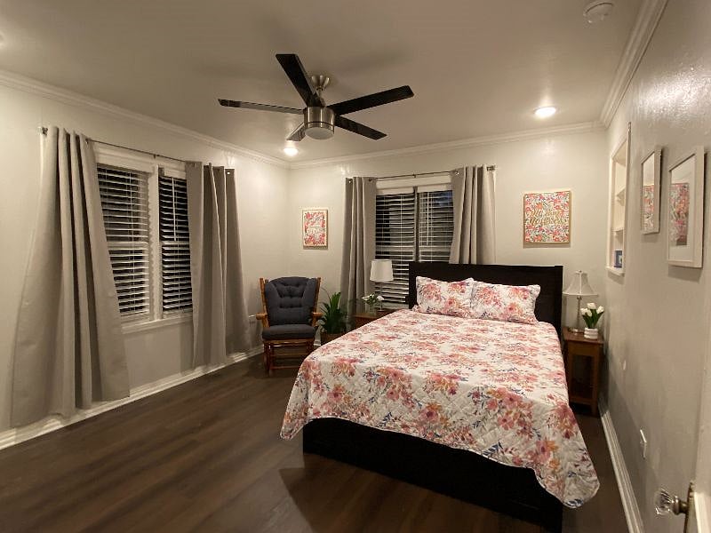 2nd bedroom with queen bed and Twin XL trundle bed, 2 nightstands, and rocking chair