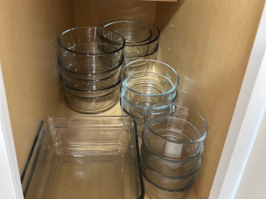 Glass storage ware, lids are in the bin on the shelf