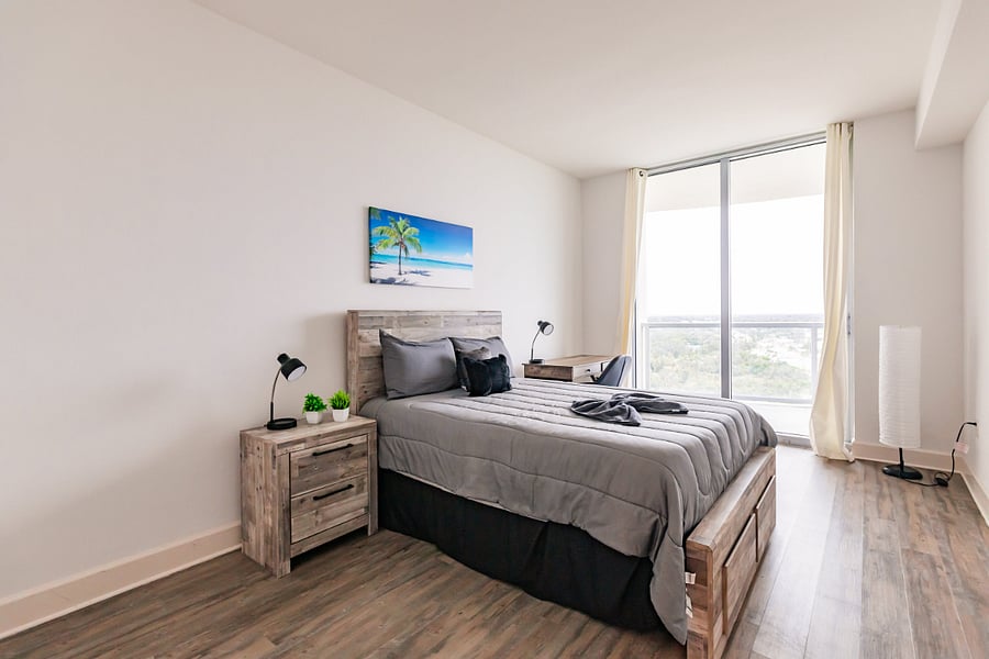 2nd bedroom full bed with city views
