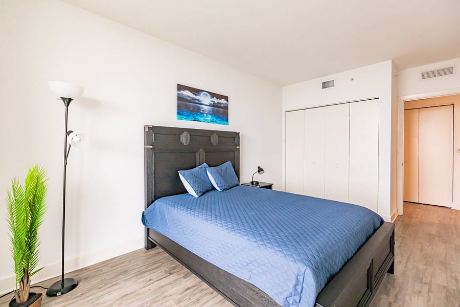3rd bedroom with queen bed & city views