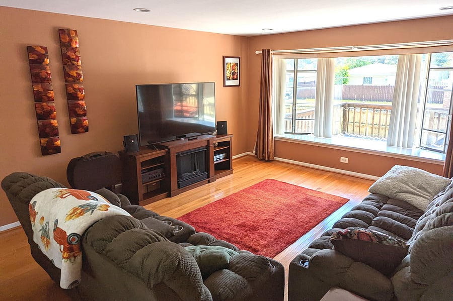 living room with large bay windows on each end