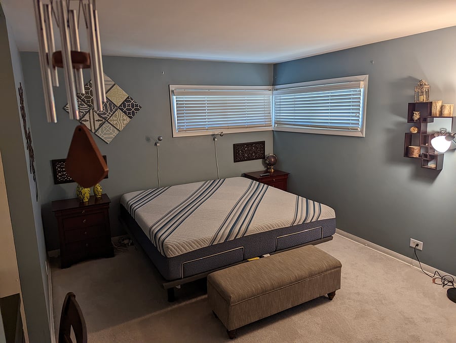 King-sized mattress on adjustable frame (Bedding is included but not shown)