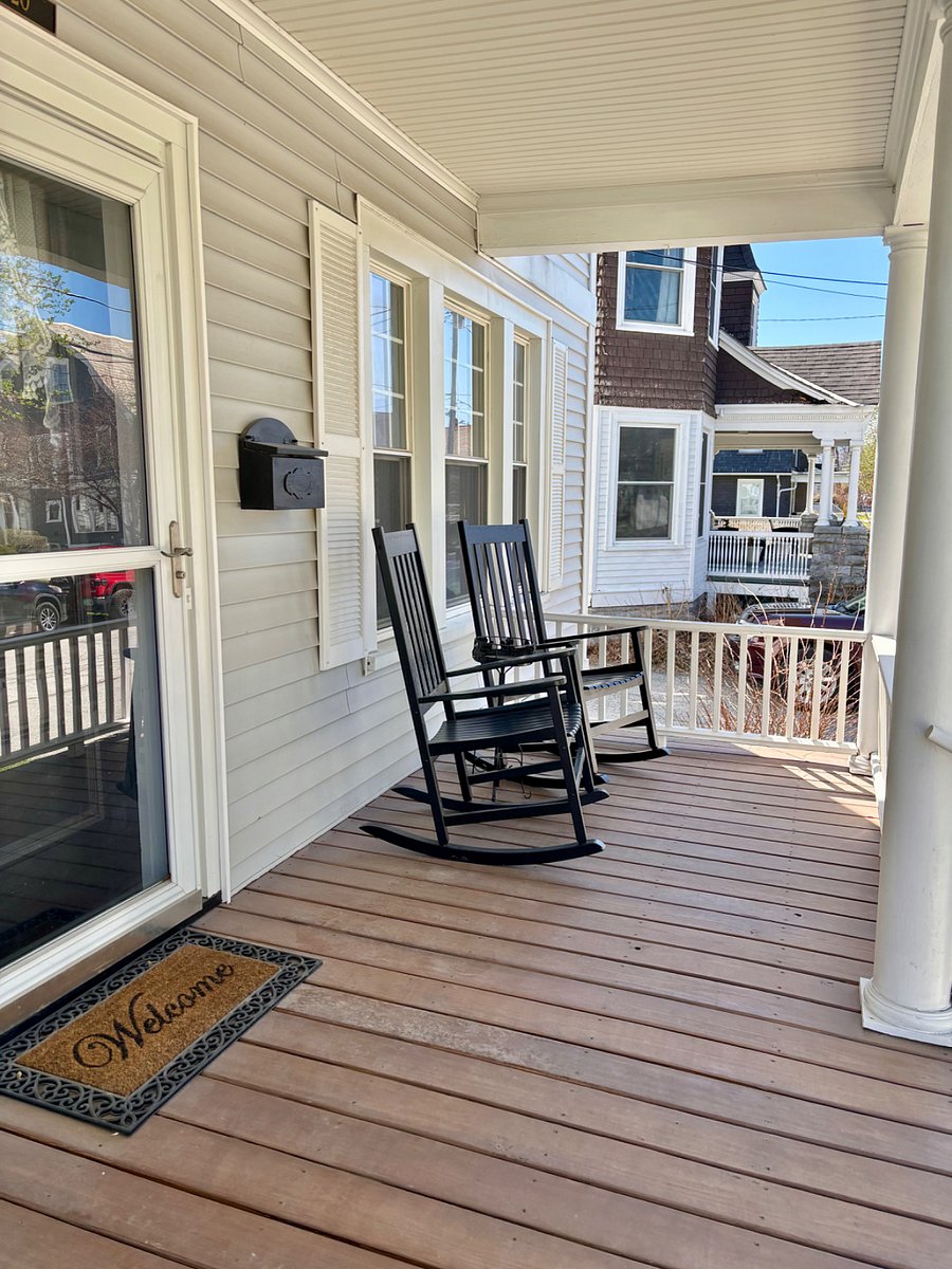 Covered shared front porch with two private rocking chairs