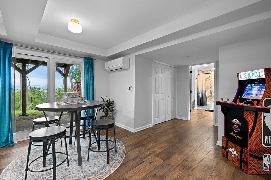 Fully furnished basement with four person dining area, games, fully furnished kitchen, large living area and a second master suite.