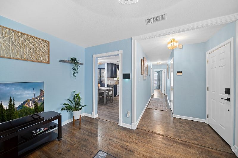 FROM LOVING ROOM OPENING TO THE KITCHEN