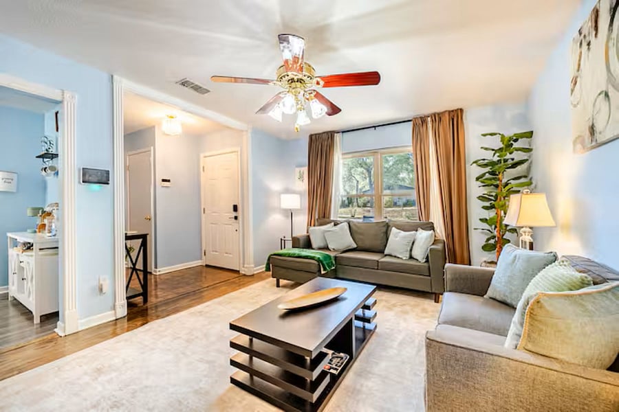 Bright and airy living space with plush seating and a smart TV. A cozy spot to relax and recharge.