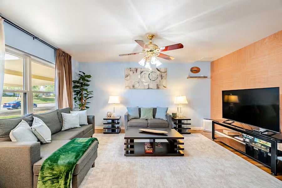 Bright and airy living space with plush seating and a smart TV. A cozy spot to relax and recharge."