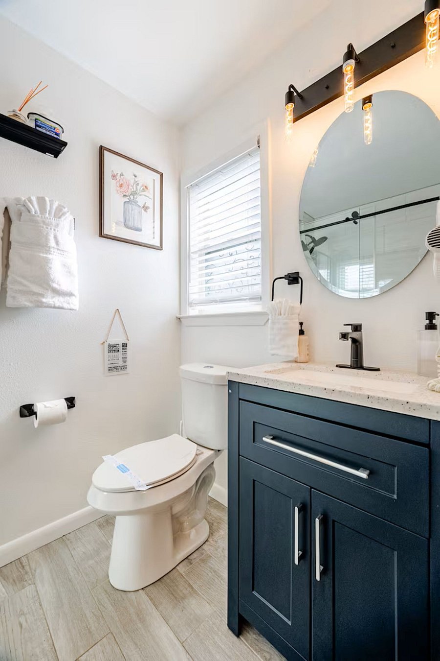 Sparkling clean master ensuite featuring a walk-in shower, ample storage for toiletries, and plush, fresh towels provided for your comfor
