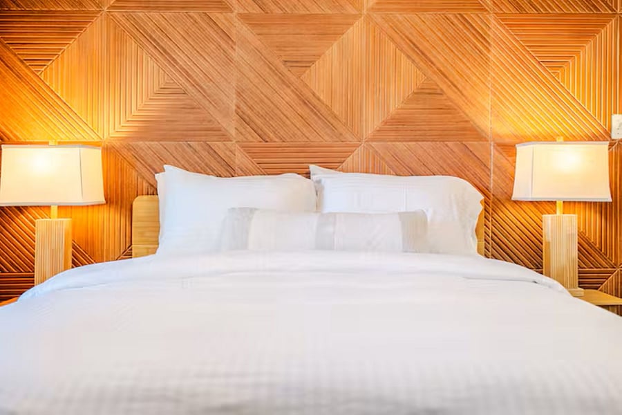 Primary Bedroom: "Serene primary suite featuring a premium queen mattress, blackout curtains, and luxury linens for a restorative sleep."