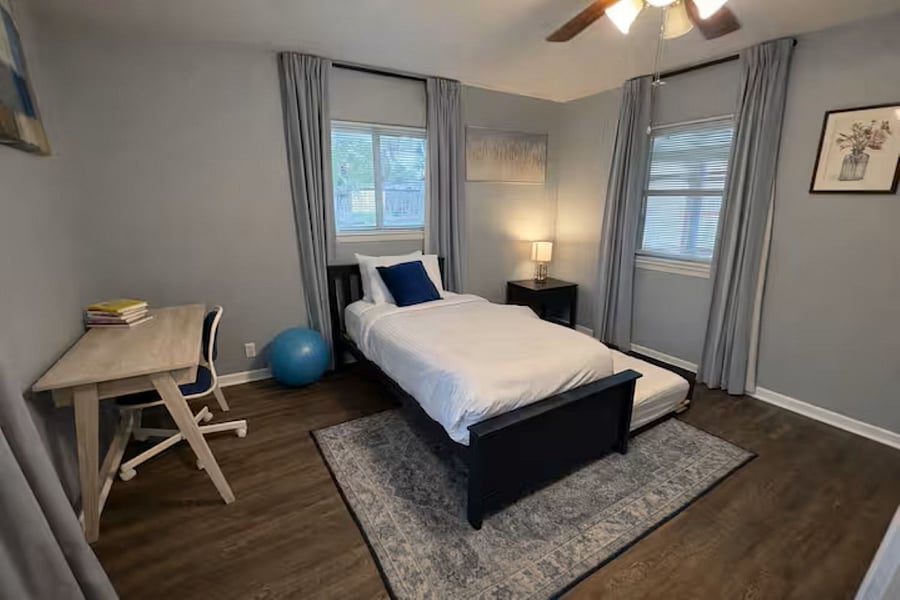 Versatile work-from-home space featuring a dedicated desk and a twin trundle bedperfect for a quiet office by day and a cozy guest room by night