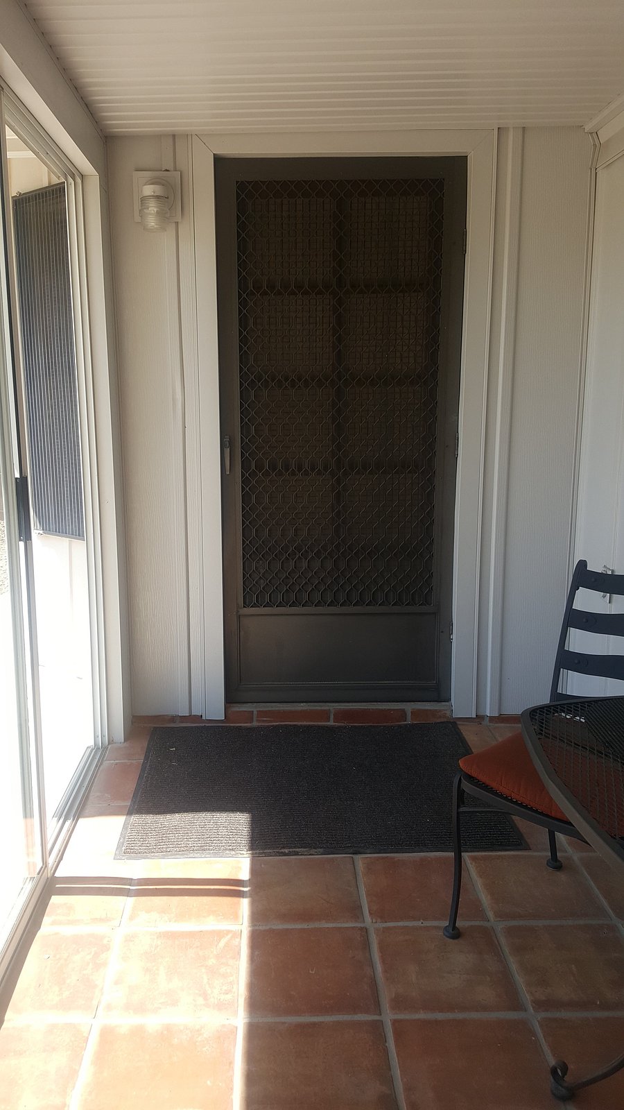 Entrance at the back porch (patio). 