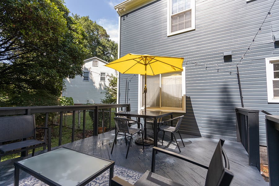 Outdoor living/dining includes ample seating