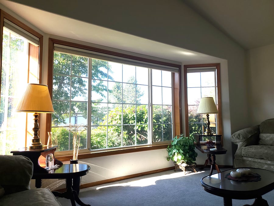 Master room with a piano and two rocking chairs.