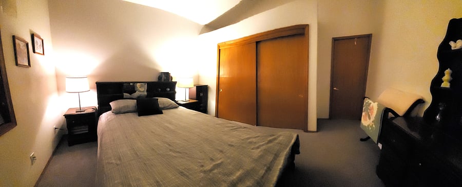 Room 2 with a queen bed, closet and bathroom outside the room. Room 2 and 3 share the bathroom.