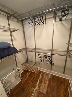 master closet with lots of space for clothes and or storage.