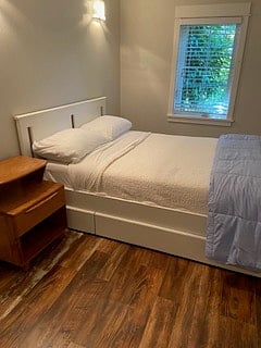 2nd bdrm or office space has full bed and two nightstand.