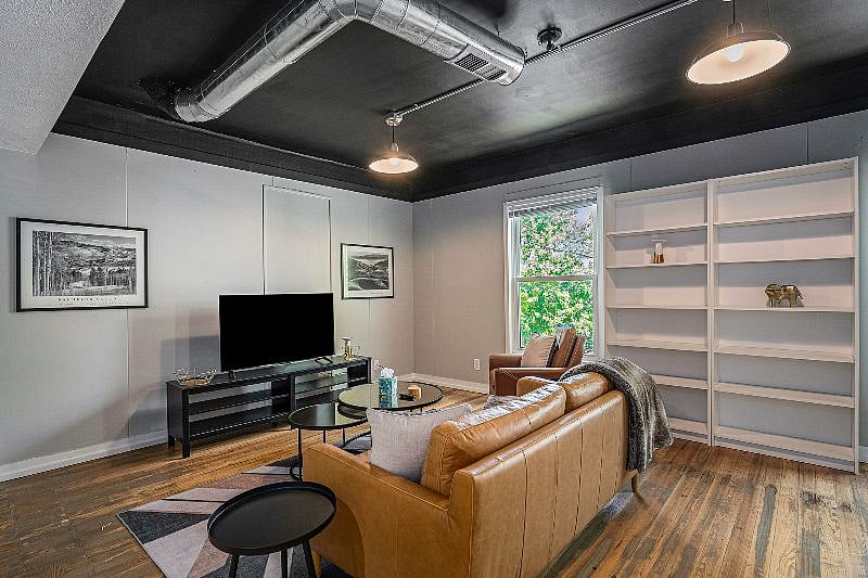The living room has a modern urban feel to it. 