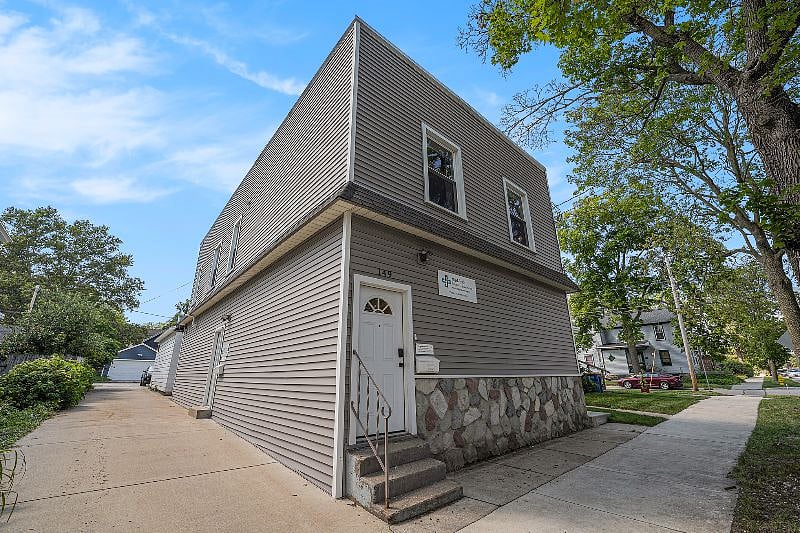 The downstairs is used by a business with very little foot traffic. Driveway access is reserved for the business only. Please park in street. There are always many spaces available.