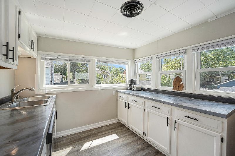 Fully stocked kitchen with many windows that allow a lot of natural sunlight in. All the utensils that you need to make and eat food are included