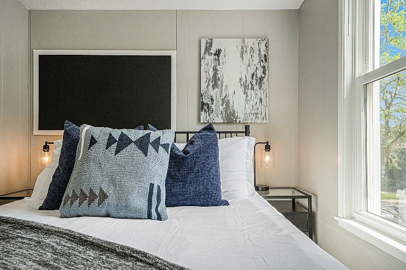 Second bedroom has multiple sleeping pillows as well as decorative pillows. There are both soft and firm pillows to satisfy everyone's sleeping needs.