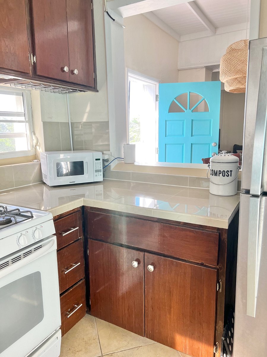 Kitchen has plenty of cabinets and fully stocked - peekabook window makes for easy serving!