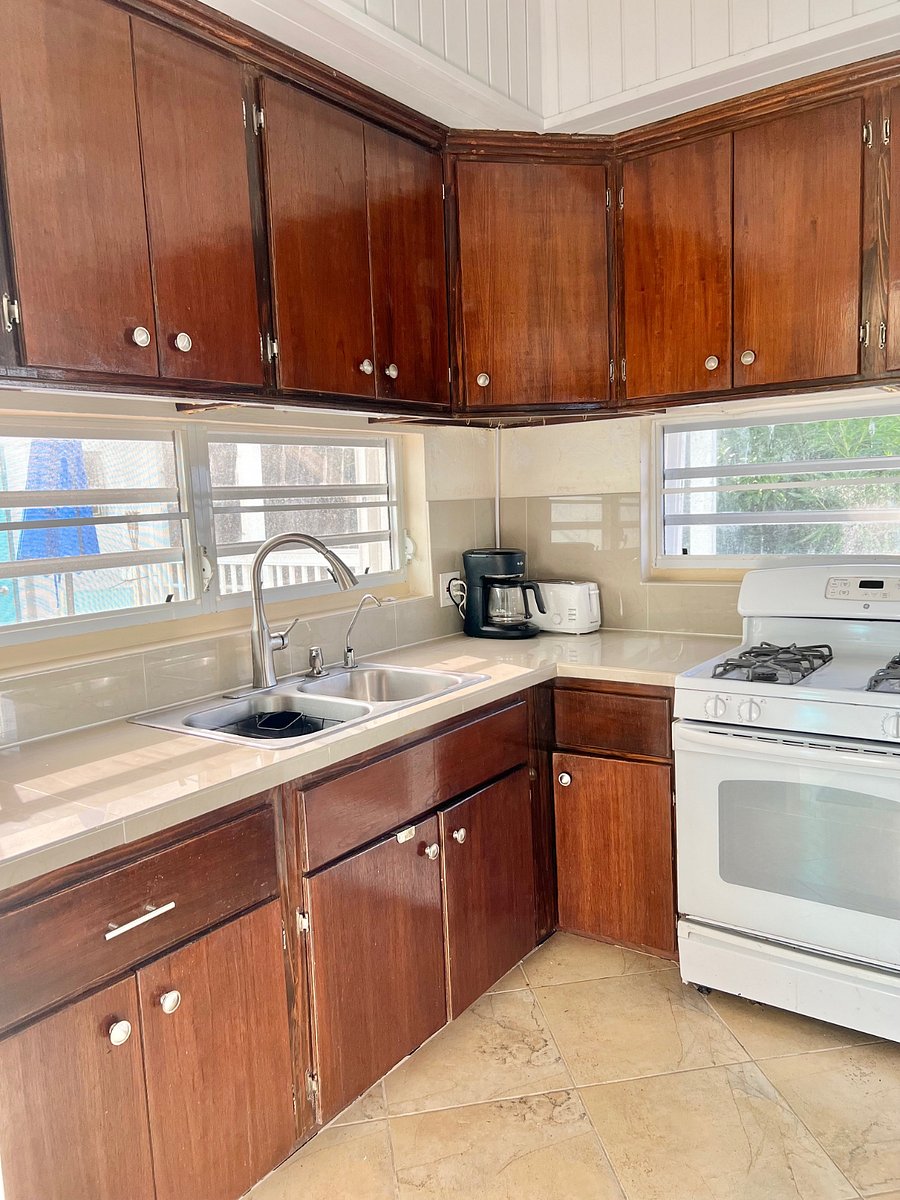 Mahogony kitchen fully stocked w/ kitchen basics, and equipped w/ coffee maker, toaster, gas oven/stove and full size fridge!
