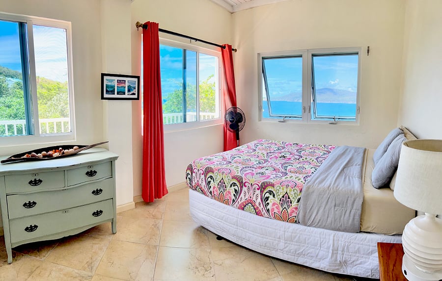 Both Queen bedrooms have front row seats to a SPECTACULAR view of the uninhabited island of Hans Lollik and other British Virgin Islands. Full Dresser/Closet and great sunsets in this bedroom.