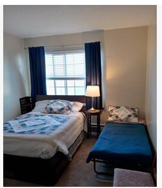 Bedroom 2 shown with single bed deployed.