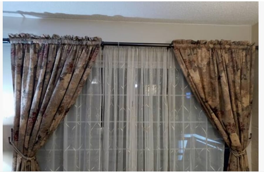 Living Room draperies allow light and privacy. Drapes are not operational. Please leave in place.