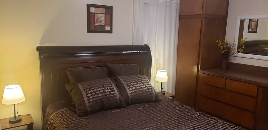Bedroom with queen size bed.