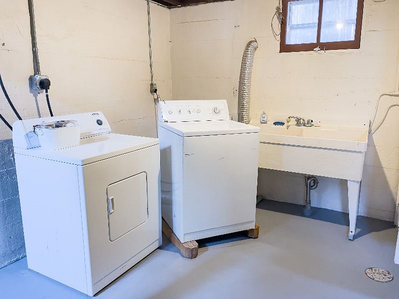 Laundry room with full-sized washer and dryer. We include a small amount of starter detergent and wool dryer balls. 