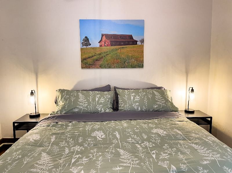 King bedroom. USB outlets are included in the bedside lamps. 