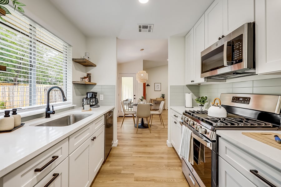 Kitchen and Dining area - Prepare your gourmet meals in this fully remodeled kitchen with your groceries from HEB Grocers (3 Minute Drive), Whole Foods (3 Minute Drive), or Costco (8 Minute Drive).