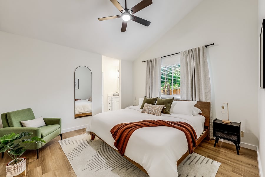 Our primary bedroom has a soft and firm king sized Dream Cloud Premier mattress, soft cotton linens, and a duvet.