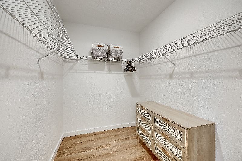 Primary Closet- Plenty of closet and drawer space for the clothes you bring with you and the clothes you purchase at The Domain outdoor mall (5 Min). Also comes with a hamper, ironing board, and iron.