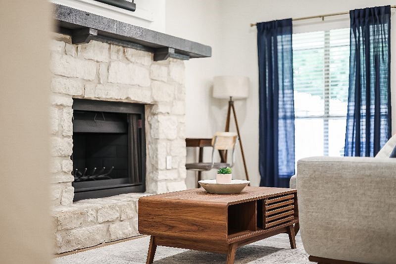 Original to the home is this stone wood burning fire place.