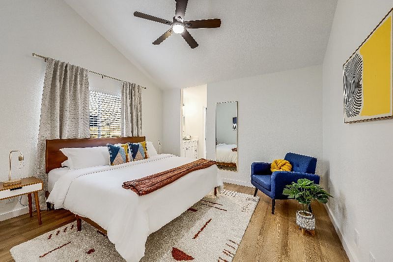 Our primary bedroom has a king sized luxurious Helix Luxe Midnight Premium mattress, soft linens, and a duvet.