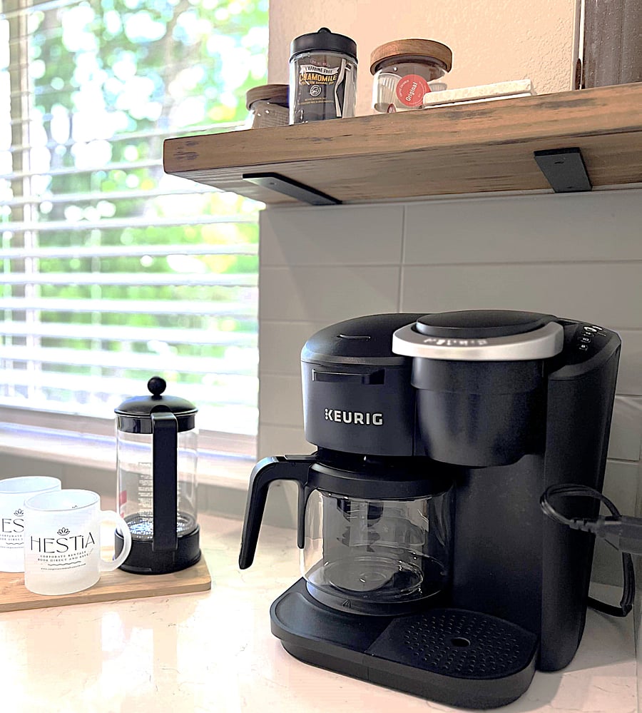 Keurig duo coffee maker with a variety of K-cups, ground coffee and tea bags for your morning convenience.
