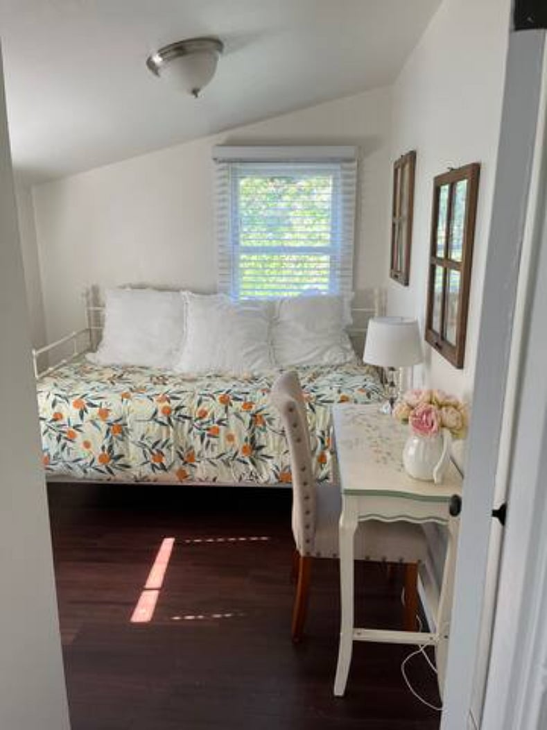 Back bedroom with twin and desk.