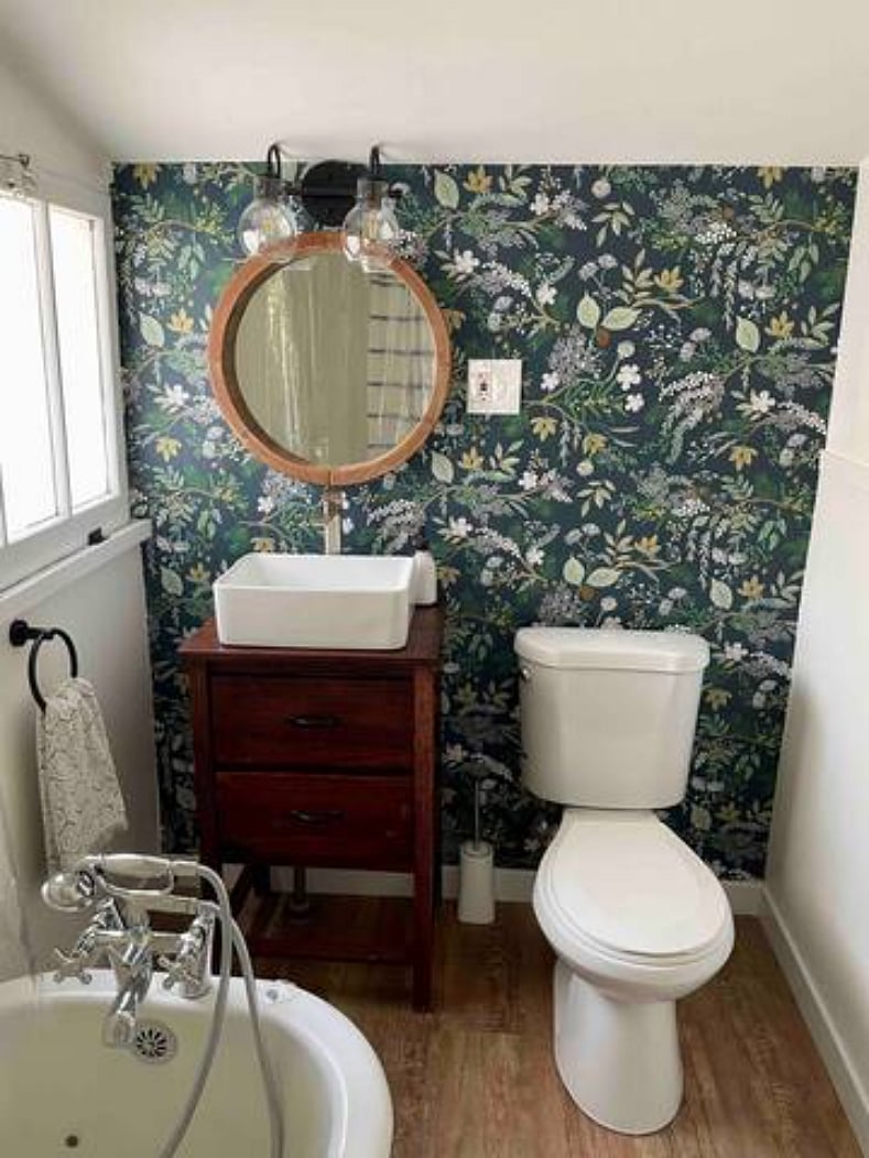 Bathroom with clawfoot tub and shower combo.