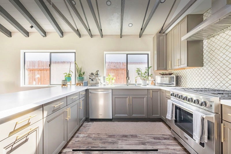Chef's kitchen with high end espresso maker & stainless-steel appliances, Thor oven
