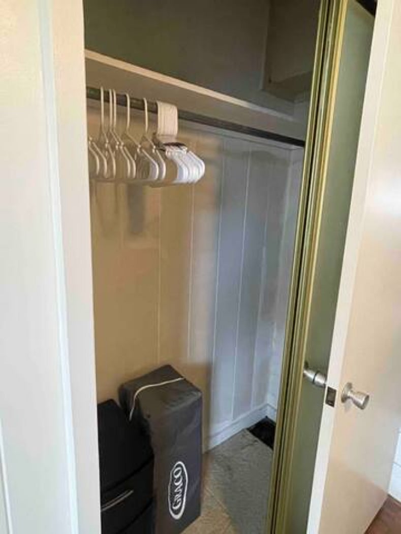 Enough hangers are provided to accommodate up to 4 guests. The iron & full-size ironing board are found in the cleaner closet in the primary bedroom (directly across from closet shown in picture). Pack N Play provided.
