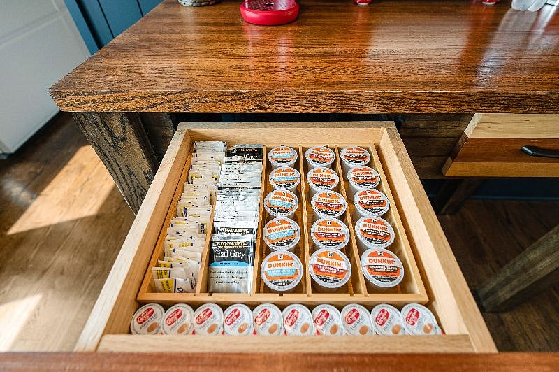 Starter Keurig coffee pods, tea sachets, sugar, creamer, and mugs are provided!